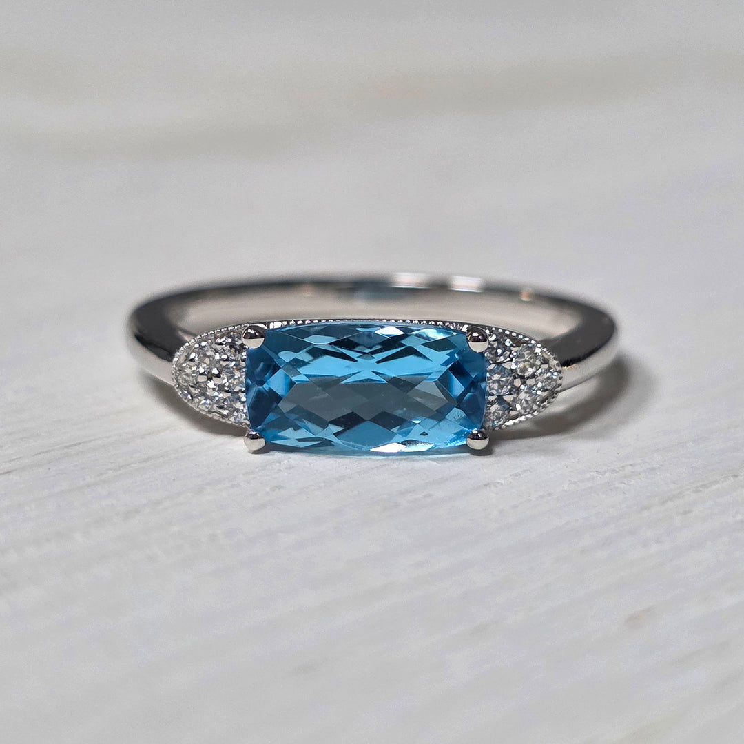 14k White Gold 1.44 ct Blue Topaz and .08 ct Diamond Ring