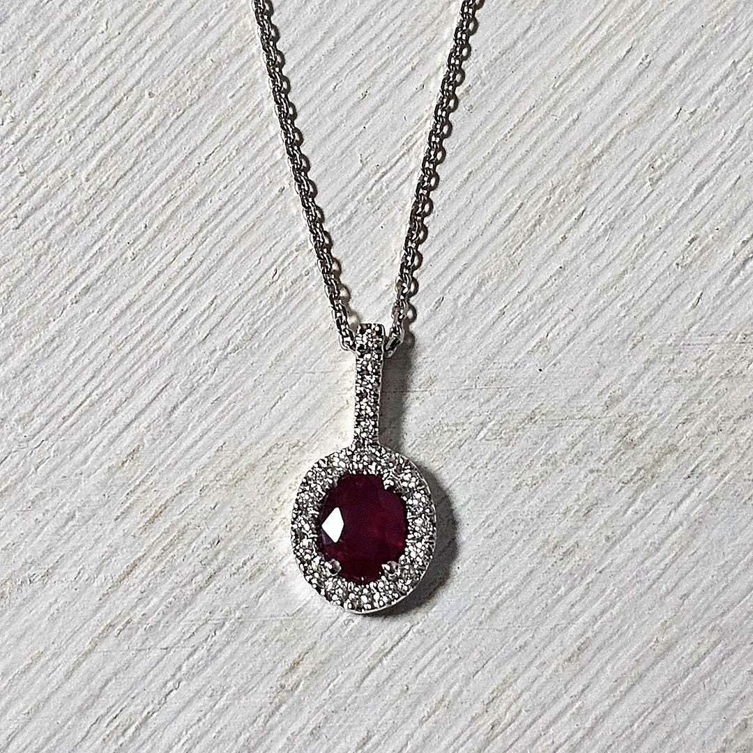 14k White Gold .53ct Ruby and Diamond Halo Pendant