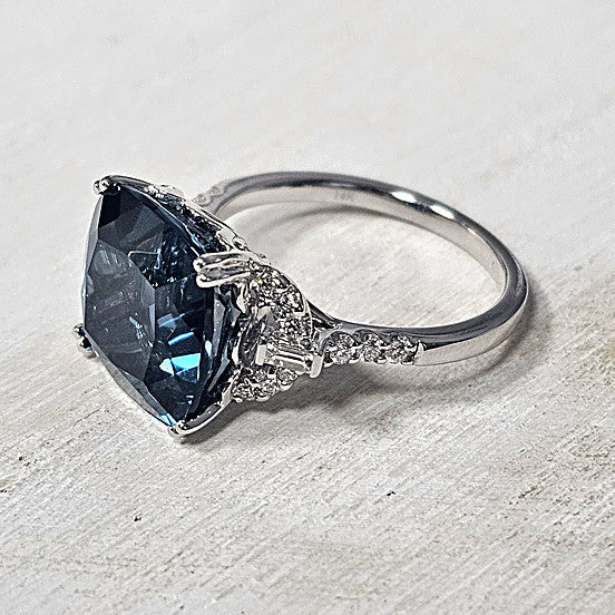 14k White Gold 9.00 Ctw Blue Topaz and 0.25 Ctw Diamond Ring