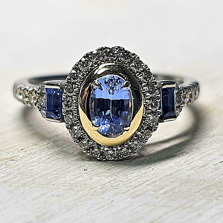 Oval Bezel Set Sapphire with Diamond Halo and Band 14k Yellow Gold Accent
