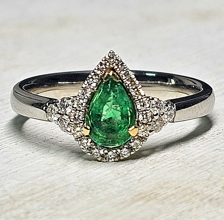 Platinum Two-Tone Pear Shape Emerald And Diamond Halo Ring