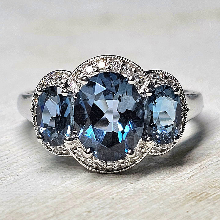 14k White Gold Oval Blue Topaz Three Stone Ring 4.33TGW