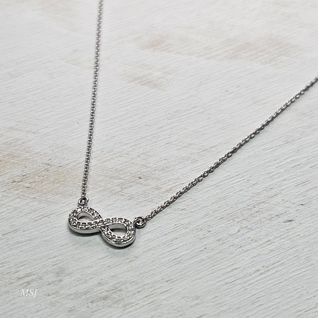 10k White Gold .11ctw Infinity Diamond Pendant