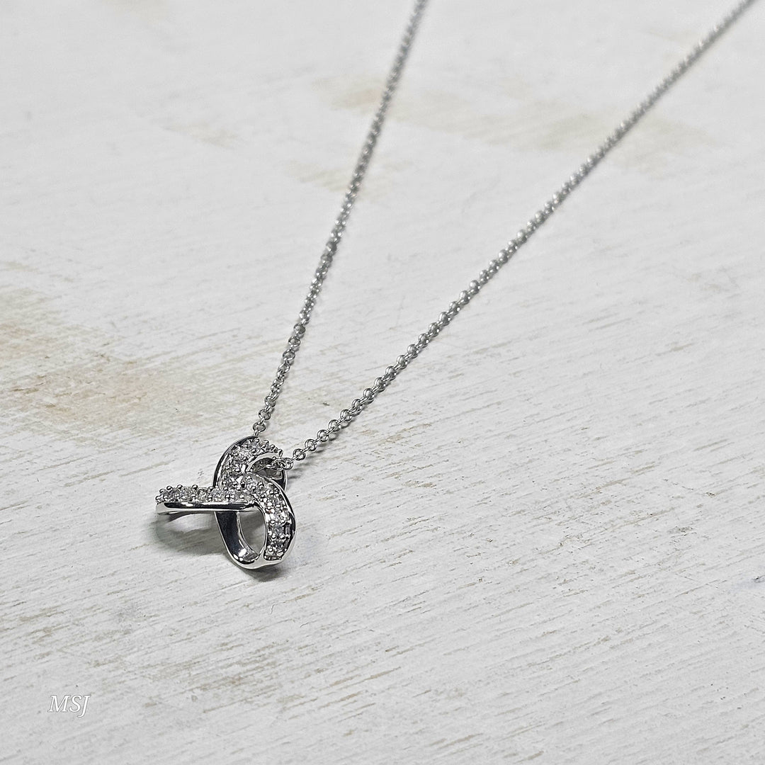 10k White Gold .08ctw Love Knot Diamond Pendant