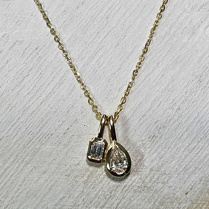 14K Yellow Gold Bezel Set Pear and Emerald Cut Diamond Double Pendant Necklace .33ctw