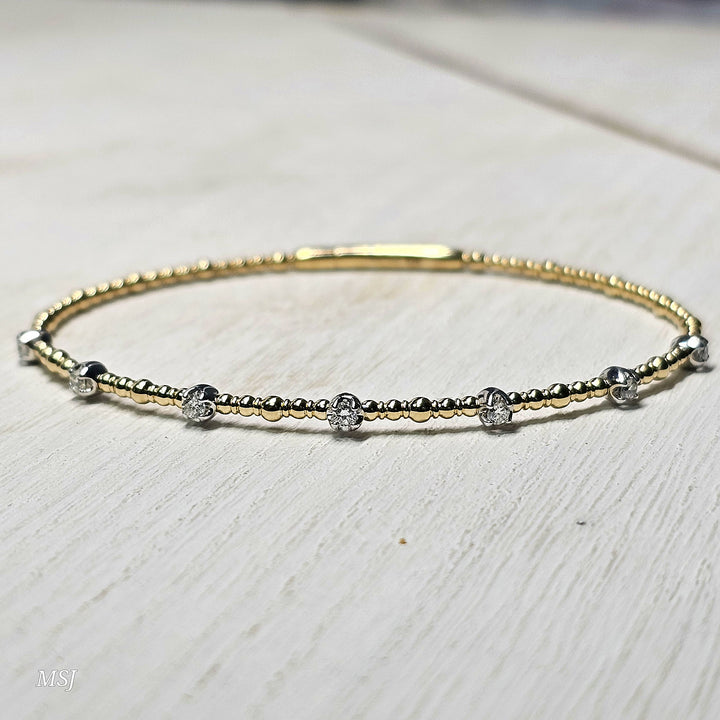 14k Two Tone 7 Station Diamond Flex Bangle .25ctw