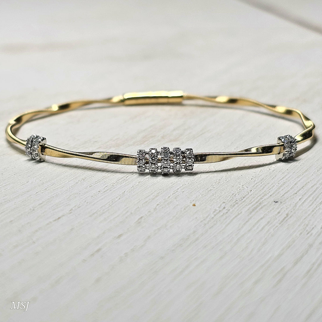14k Two Tone Twisted High Polish Flex Bangle .30ctw