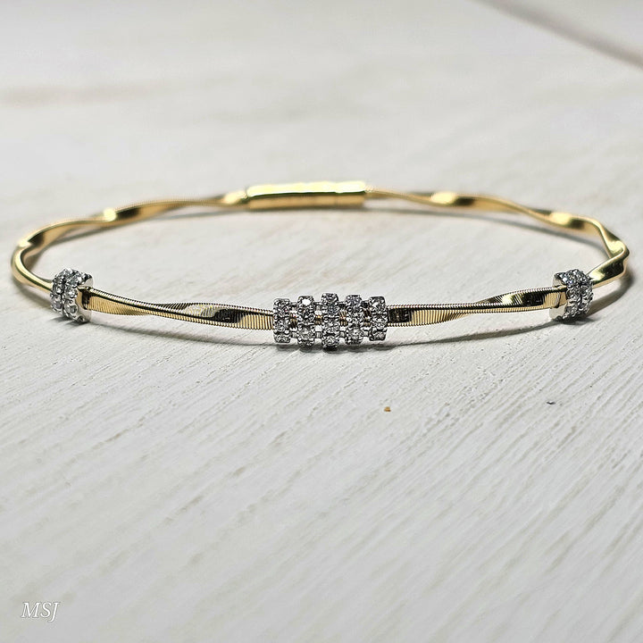 14k Two Tone Twisted High Polish Flex Bangle .30ctw
