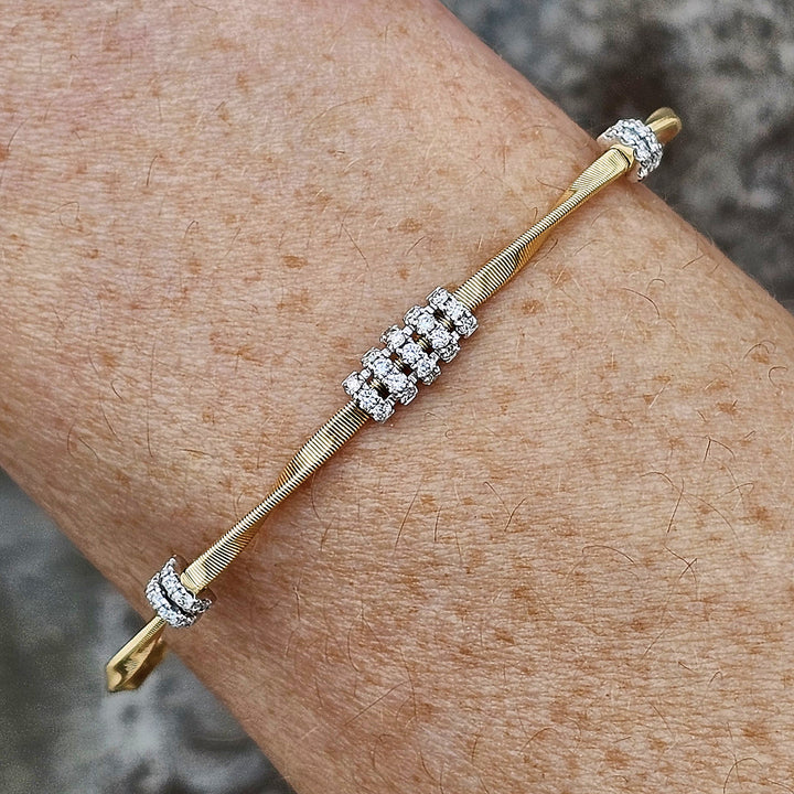 14k Two Tone Twisted High Polish Flex Bangle .30ctw