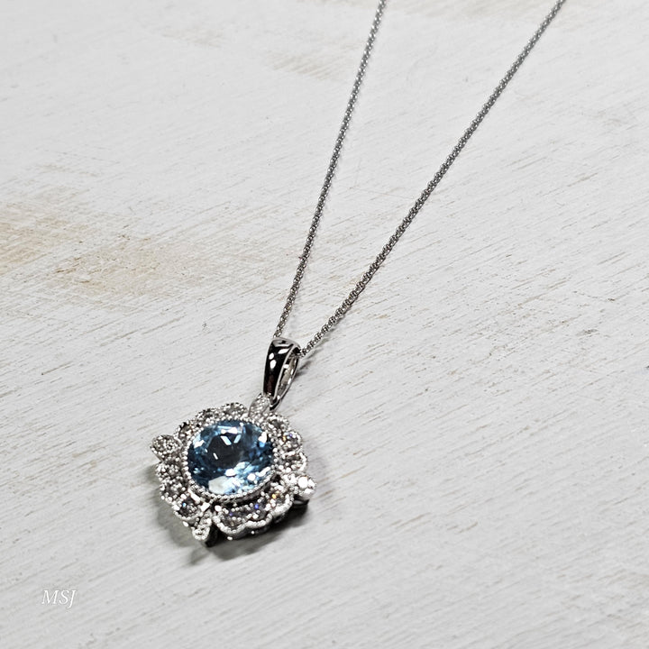 14k White Gold 2.13ctw Blue Topaz and Diamond Pendant
