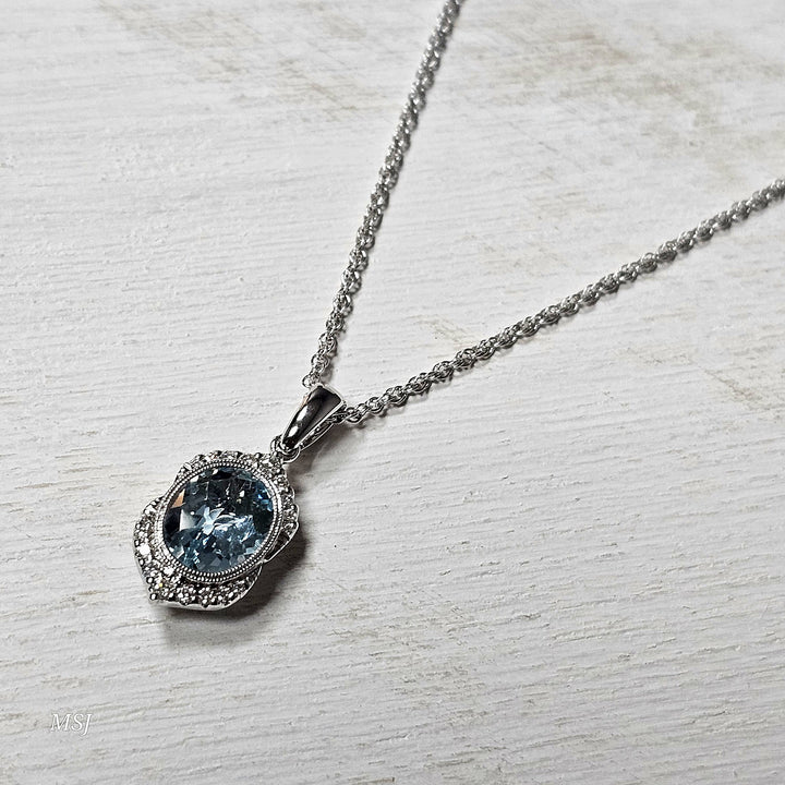 14k White Gold 1.54ctw Aquamarine and Diamond Halo Pendant
